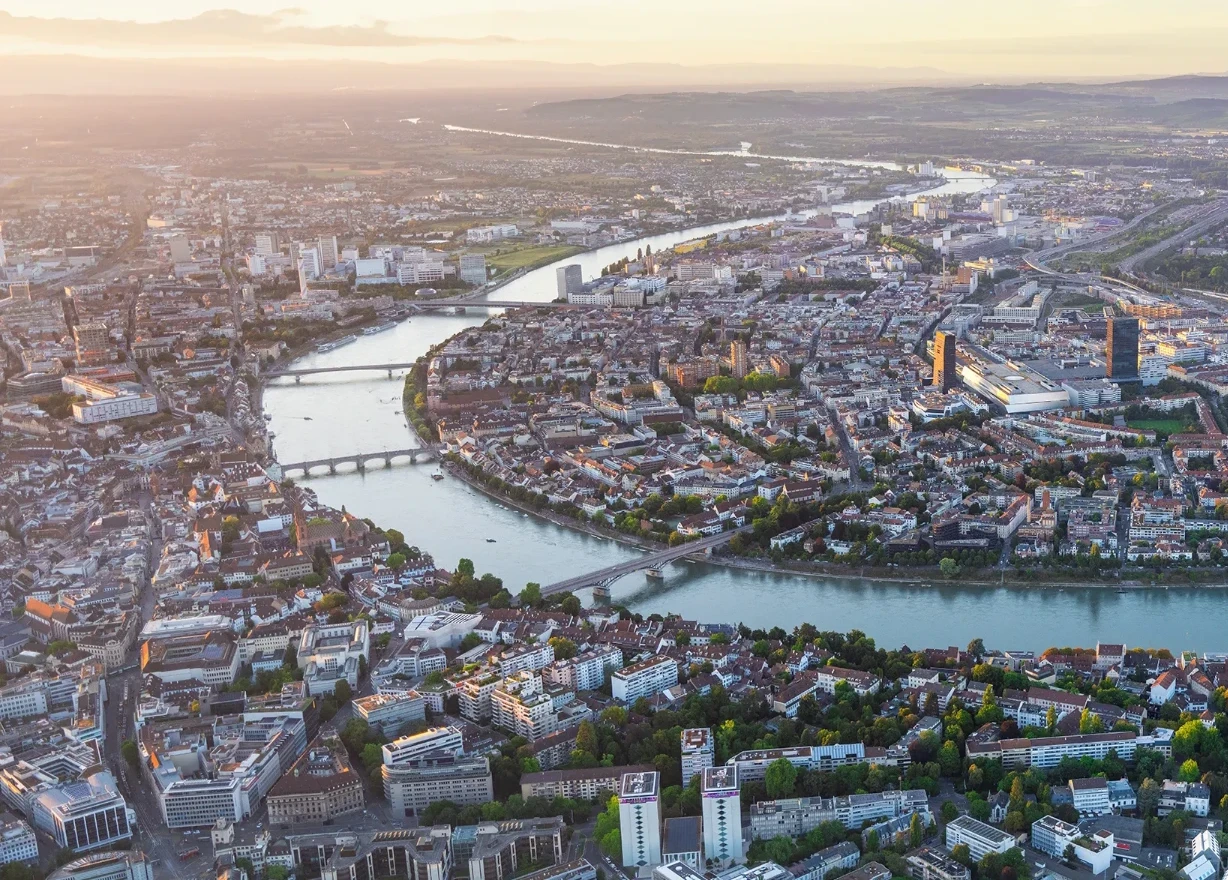 Basel’s Rhine, bridges and historic city centre in daylight.